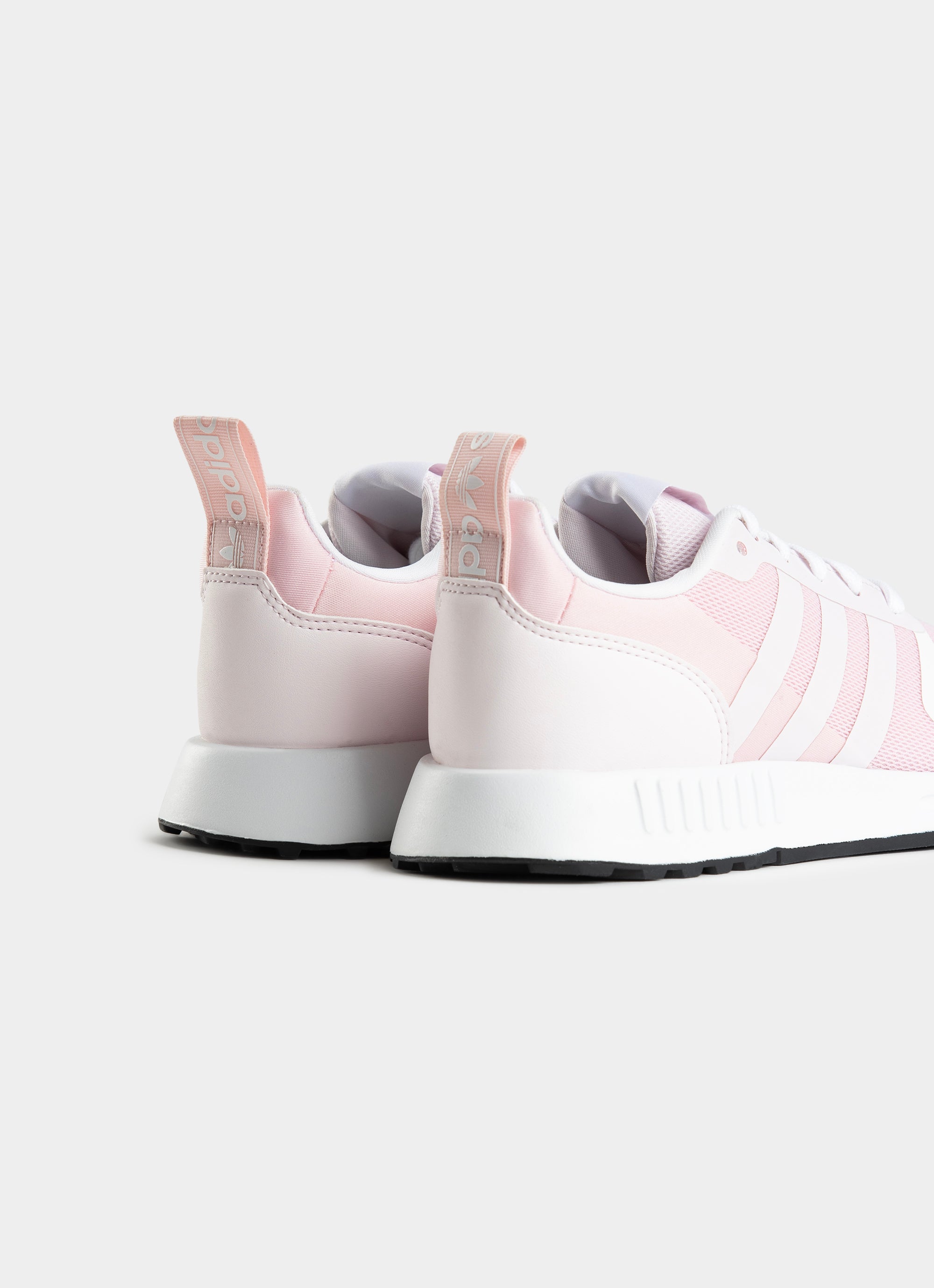 White adidas best sale with pink back