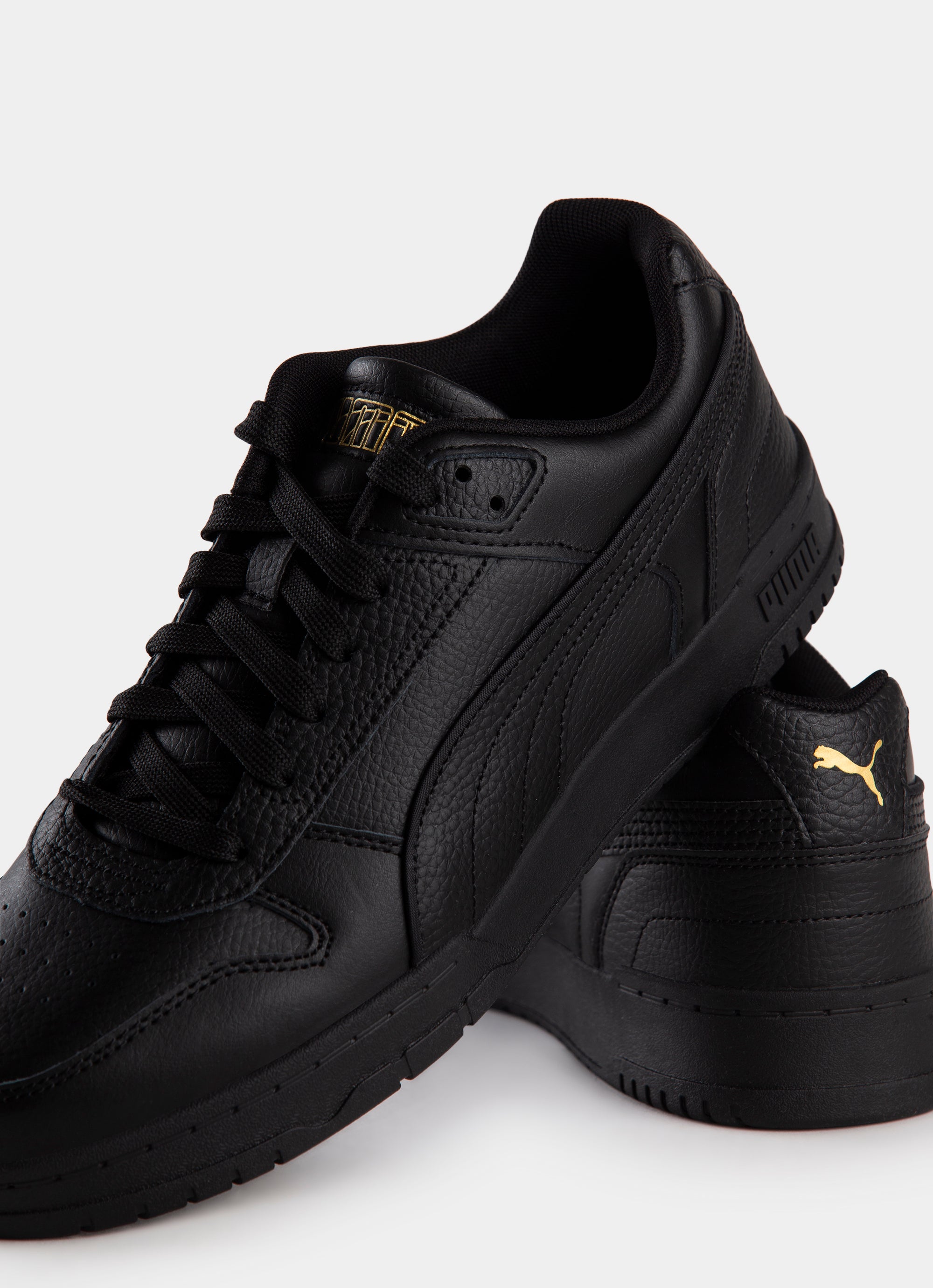 Black and outlet gold pumas today